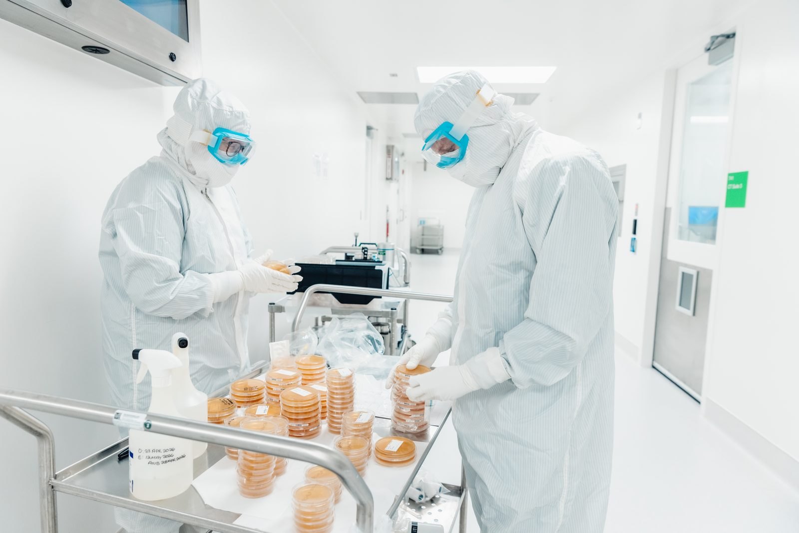 MADE Scientific operators gowned and working in a cleanroom suite